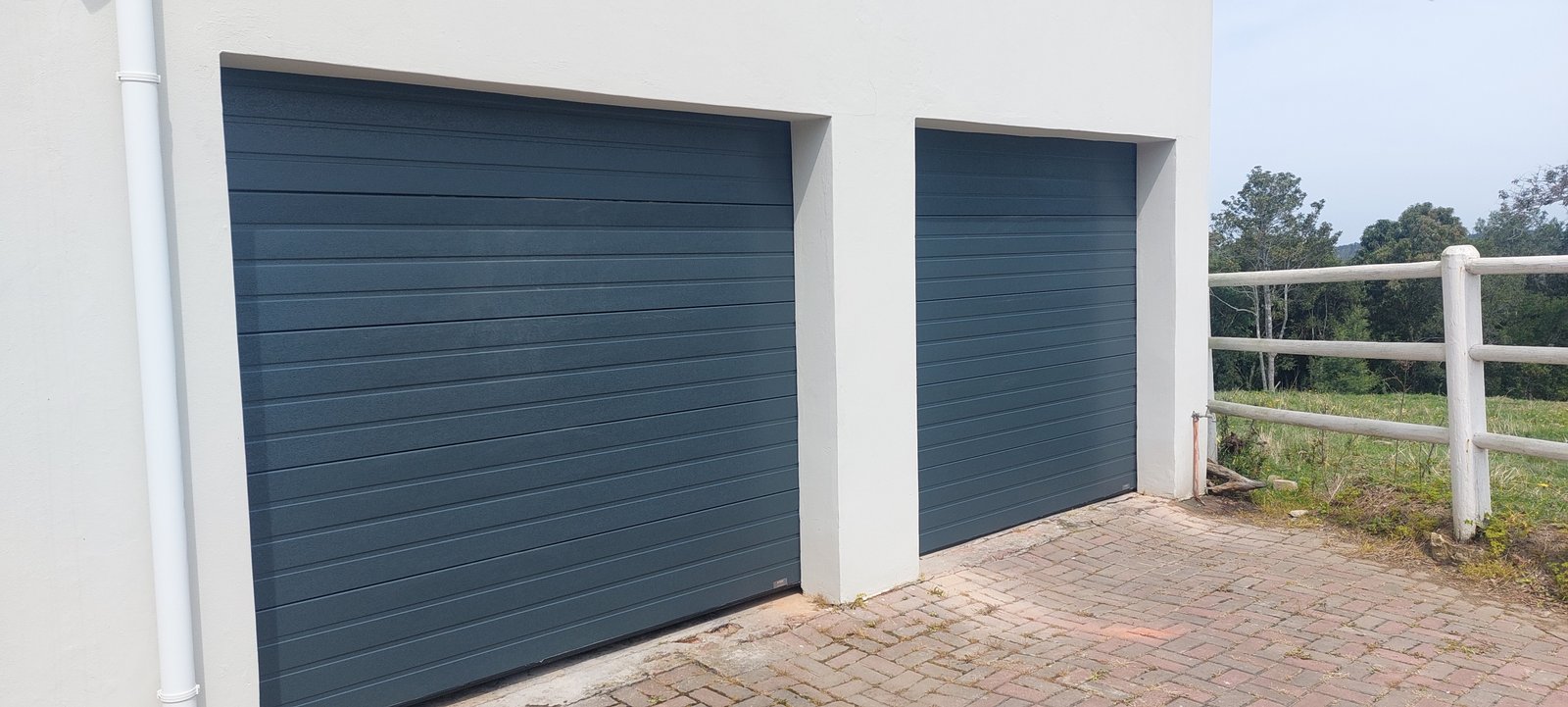 Contemporary garage doors installed by Featherbleu