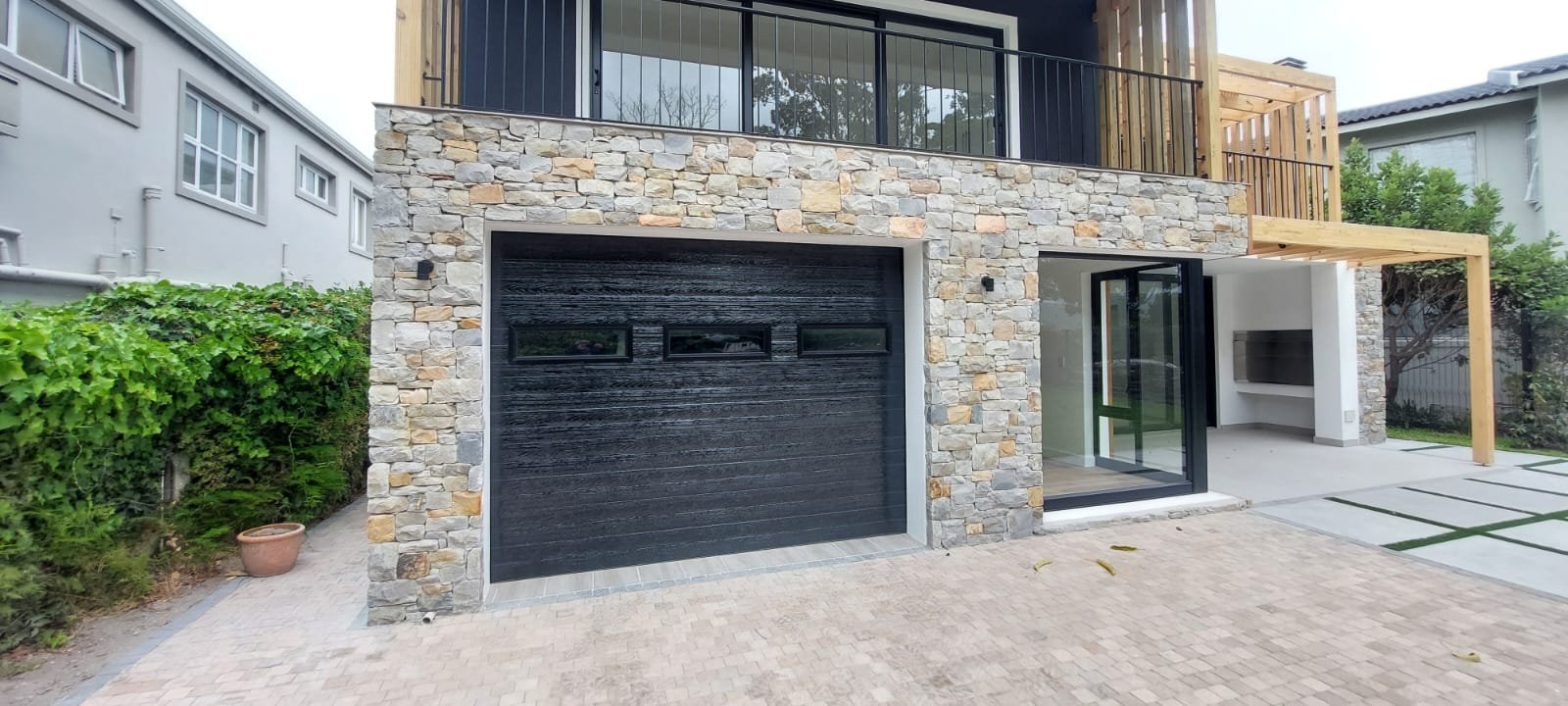 Garage Door - Stone Facade Home